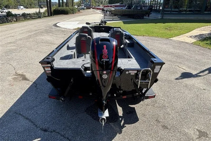Slide: The Image of 2026 Ranger VS1882SC Angler boat with 150 HP engine, parked outdoors. - 11