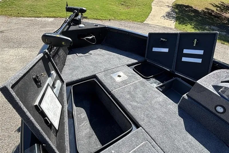 Slide: The Image of 2026 Ranger VS1882SC Angler boat interior with open storage compartments and trolling motor. - 19
