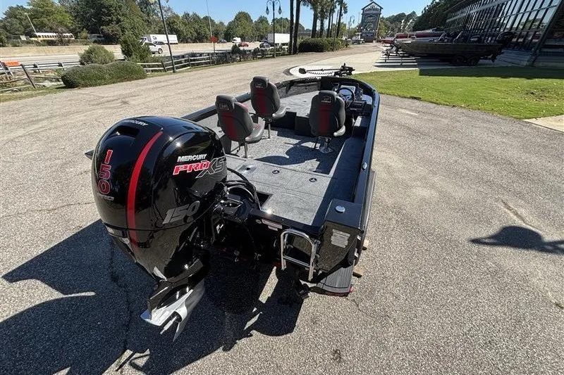 Slide: The Image of 2026 Ranger VS1882SC Angler boat with Mercury 150 Pro XS engine, parked outdoors. - 9