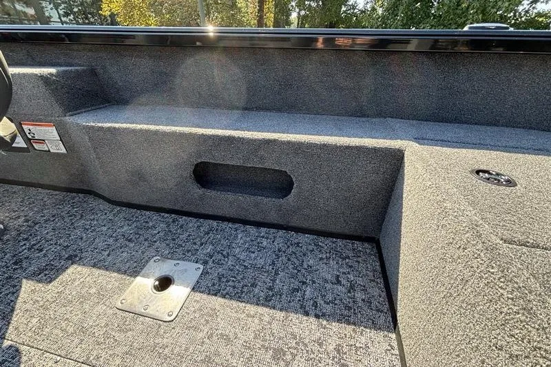 Slide: The Image of 2026 Ranger VS1882SC Angler boat interior with carpeted flooring and storage compartments. - 32
