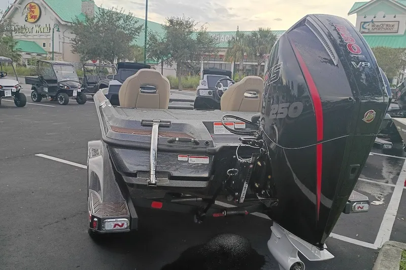Slide: The Image of 2027 Nitro Z21 XL Pro boat with powerful outboard motor in parking lot. - 3