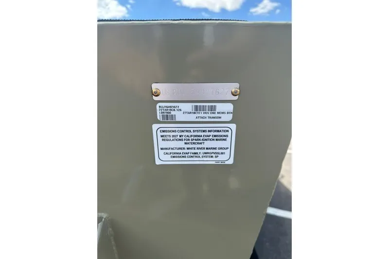 Slide: The Image of Sticker on 2027 Tracker Targa V-18 Combo detailing emissions control information. - 52
