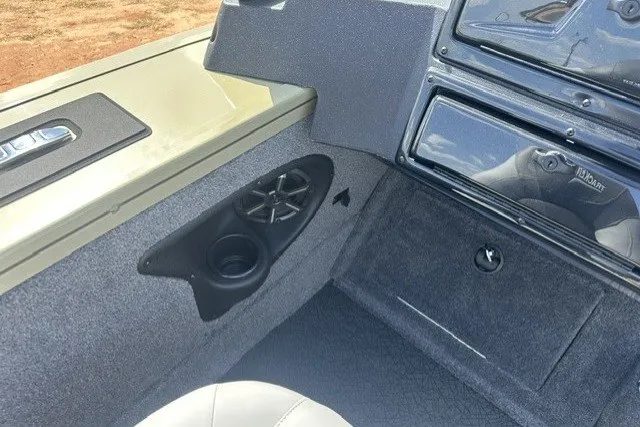 Slide: The Image of 2027 Tracker Targa V-18 Combo boat interior with speaker and cup holder. - 14
