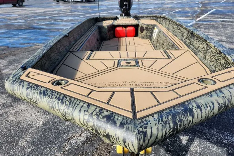 Slide: The Image of 2027 Tracker Grizzly 1654 T Sportsman boat with camouflage design and spacious deck. - 13