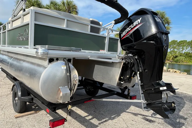 The Image of 2027 Sun Tracker Bass Buggy 16 XL Select pontoon boat with Mercury outboard motor. - 0