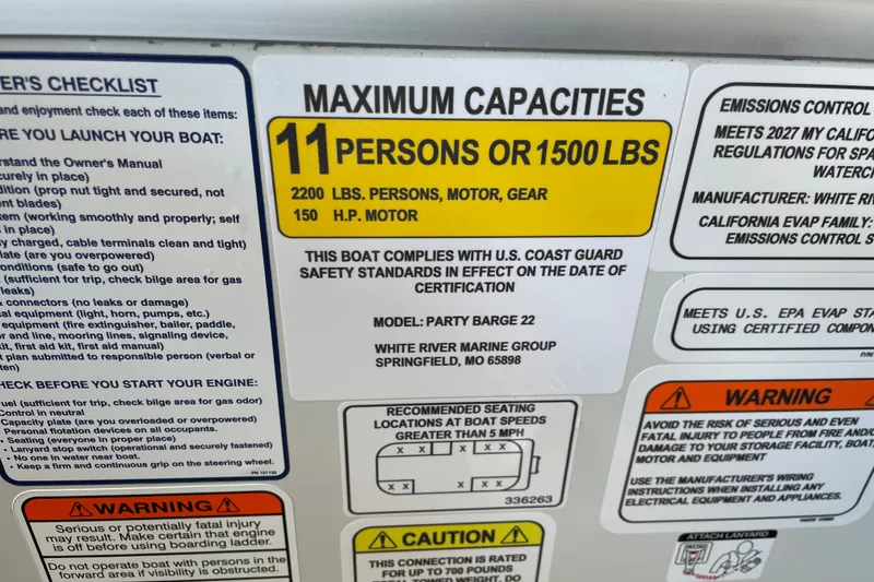 Slide: The Image of Sun Tracker Party Barge 22 DLX 2027 capacity label: 11 persons or 1500 lbs, 150 HP motor. - 51