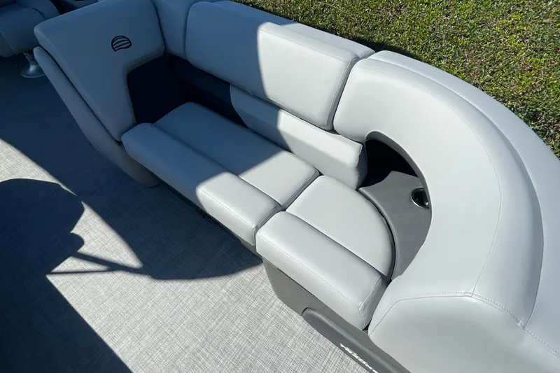 Slide: The Image of 2027 Sun Tracker Party Barge 22 DLX, featuring luxurious gray seating and modern design. - 26