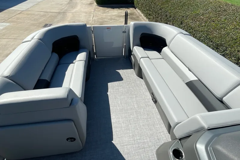 Slide: The Image of 2027 Sun Tracker Party Barge 22 DLX interior with spacious seating and modern design. - 22