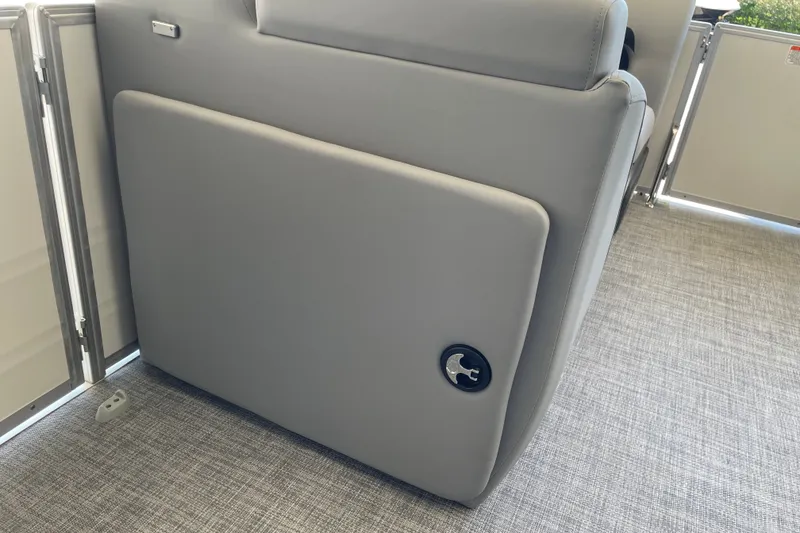 Slide: The Image of 2027 Sun Tracker Party Barge 22 DLX interior with gray seating and textured flooring. - 33