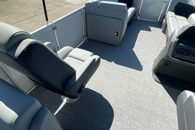 Slide: The Image of Interior of 2027 Sun Tracker Party Barge 22 DLX, featuring spacious seating and modern design. - 21