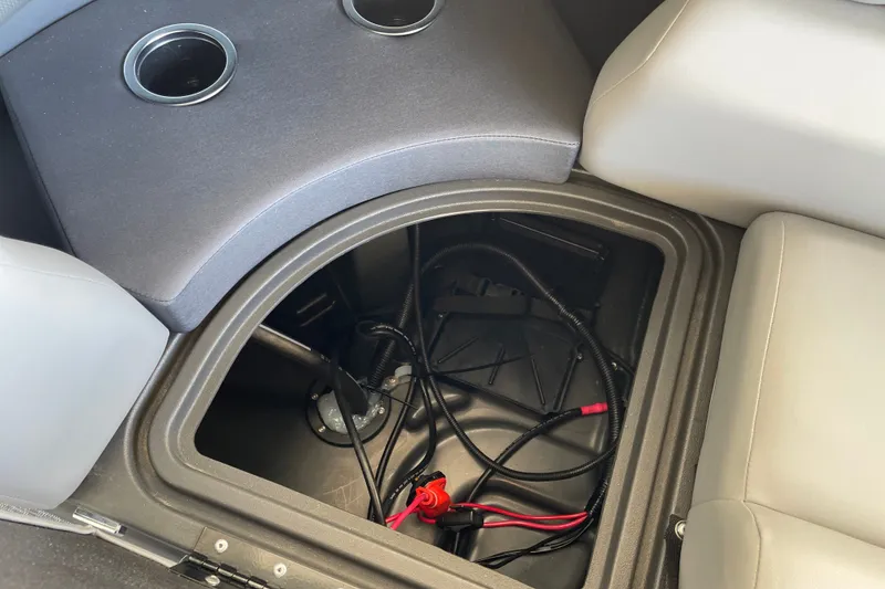 Slide: The Image of Storage compartment in 2027 Sun Tracker Party Barge 22 DLX with wiring and cup holders. - 46