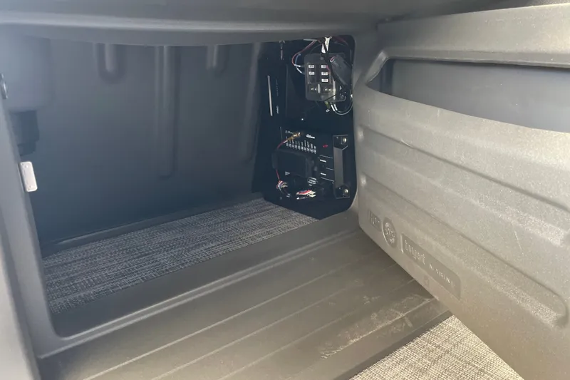Slide: The Image of Interior view of a 2027 Sun Tracker Party Barge 22 DLX storage compartment. - 41