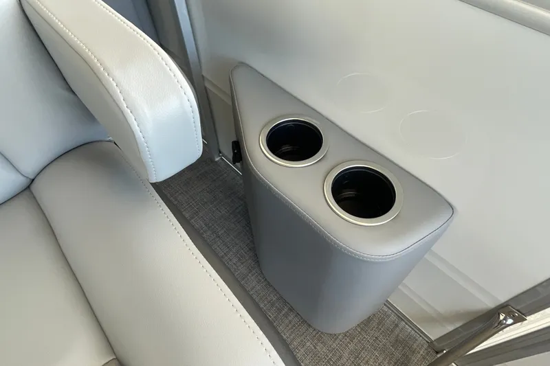 Slide: The Image of 2027 Sun Tracker Party Barge 22 DLX interior with cup holders and seating. - 29