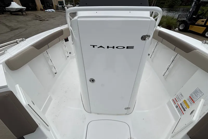 Slide: The Image of 2027 Tahoe 2150 CC boat interior with white seating and storage compartments. - 5