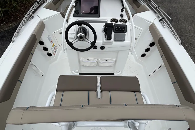Slide: The Image of 2027 Tahoe 2150 CC boat interior with steering wheel and control panel. - 11