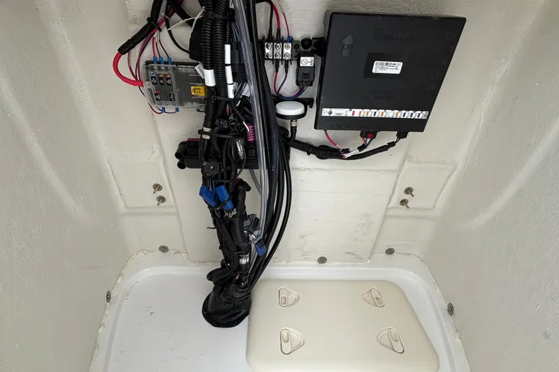 Slide: The Image of Electrical wiring and components inside a 2027 Tahoe 2150 CC boat compartment. - 6