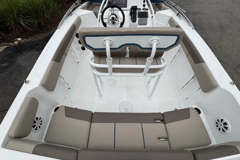 Slide: The Image of 2027 Tahoe 2150 CC boat interior with seating and steering console. - 14
