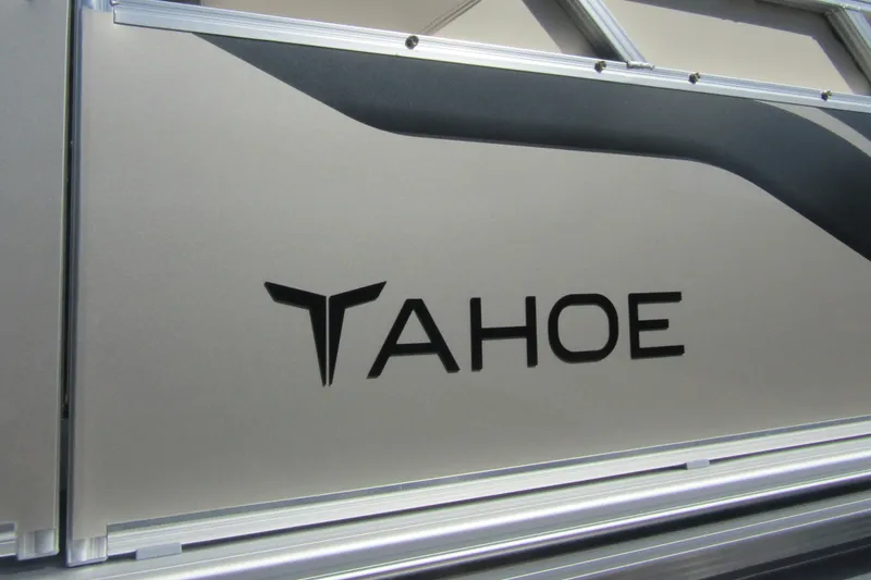 Slide: The Image of 2026 Tahoe Pontoon Sport 85 Rear Fish 21 logo on sleek metallic surface. - 7