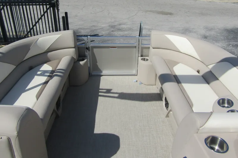 Slide: The Image of 2026 Tahoe Pontoon Sport 85 Rear Fish 21 interior with beige seating and cup holders. - 11