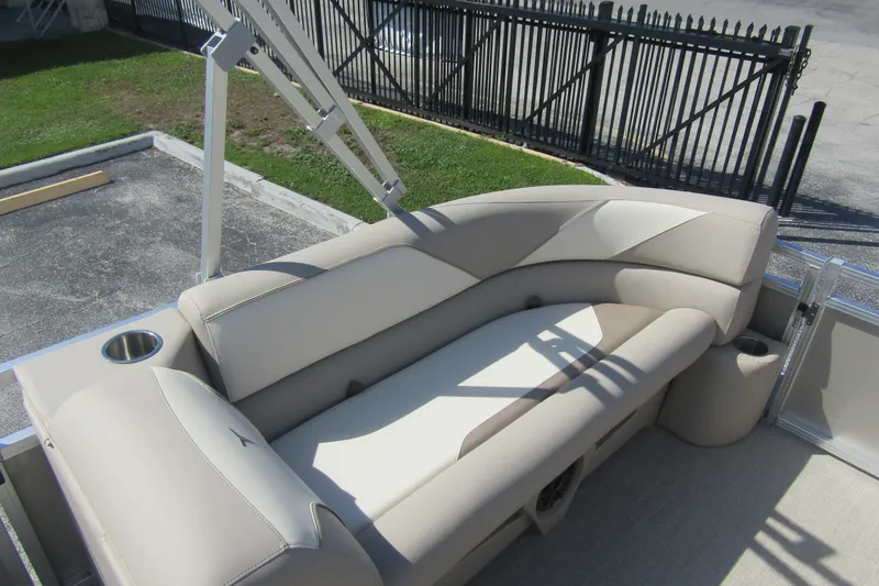 Slide: The Image of 2026 Tahoe Pontoon Sport 85 Rear Fish 21 with beige seating and cup holders. - 12