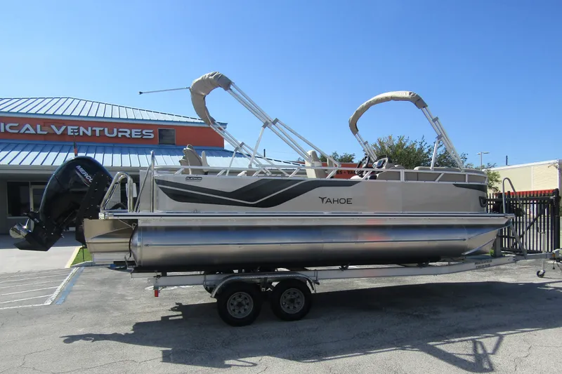 Slide: The Image of 2026 Tahoe Pontoon Sport 85 Rear Fish 21 on trailer, parked outside dealership. - 3