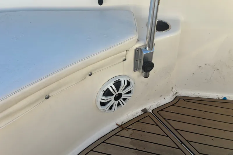 Slide: The Image of Key West 244 Center Console 2010 boat interior with speaker and rod holder. - 6
