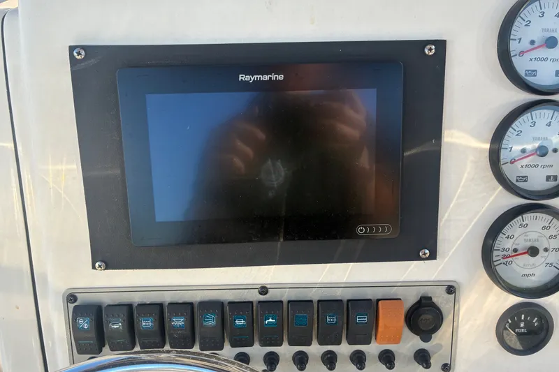 Slide: The Image of Control panel of 2010 Key West 244 Center Console with Raymarine display and gauges. - 42