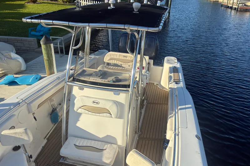 Slide: The Image of 2010 Key West 244 Center Console boat docked by the water. - 10