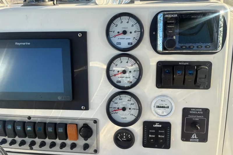 Slide: The Image of Control panel of a 2010 Key West 244 Center Console boat with gauges and switches. - 41