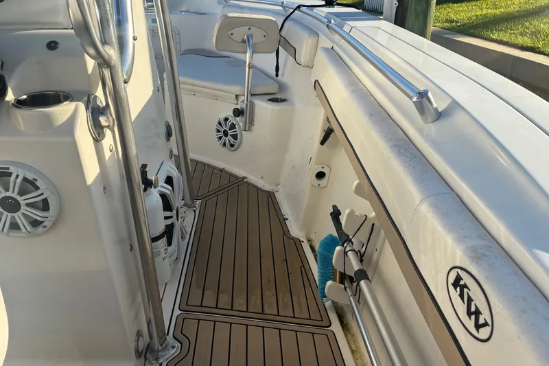 Slide: The Image of Interior of a 2010 Key West 244 Center Console boat with speakers and storage. - 14