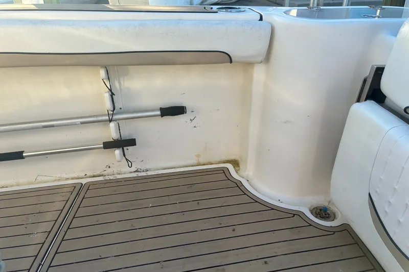 Slide: The Image of Interior of a 2010 Key West 244 Center Console boat with rod holders and non-slip flooring. - 37