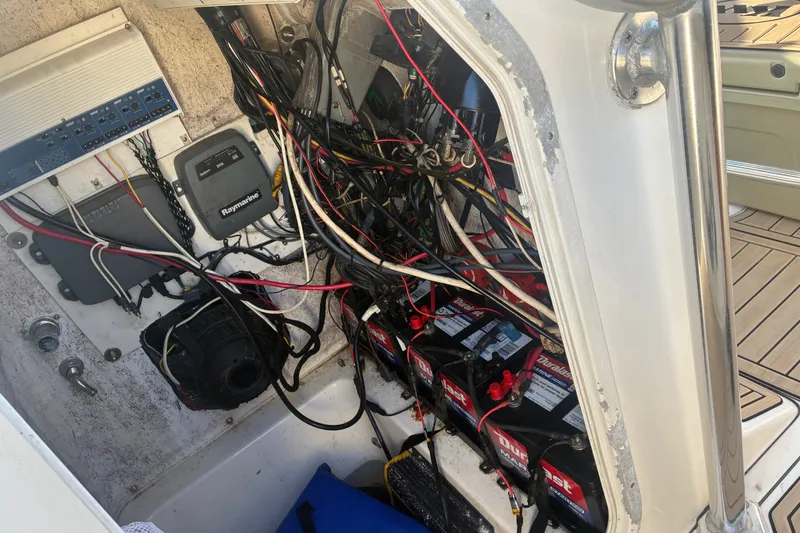 Slide: The Image of Electrical wiring and battery setup inside a 2010 Key West 244 Center Console boat. - 46