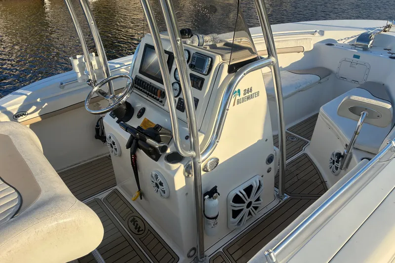 Slide: The Image of 2010 Key West 244 Center Console boat interior with steering wheel and control panel. - 16