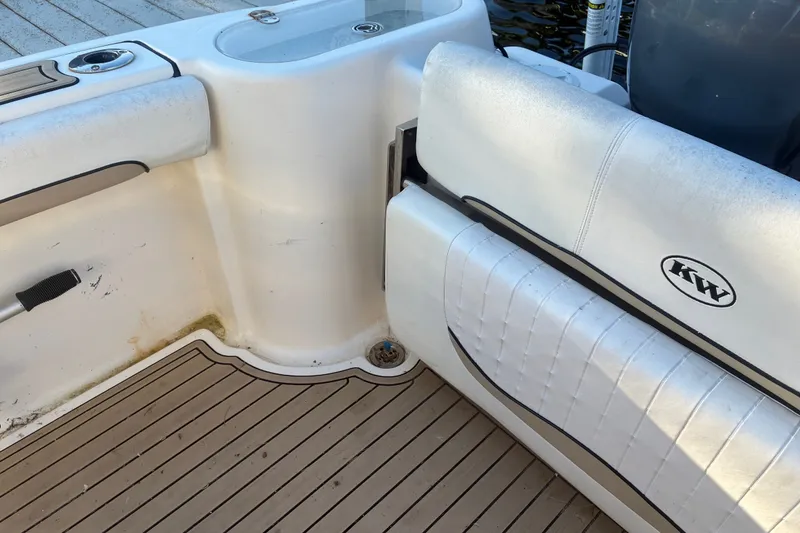 Slide: The Image of 2010 Key West 244 Center Console boat interior with seating and deck details. - 35