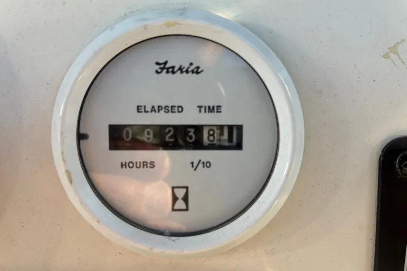 Slide: The Image of Faria elapsed time gauge showing 923.8 hours on a 2010 Key West 244 Center Console. - 43