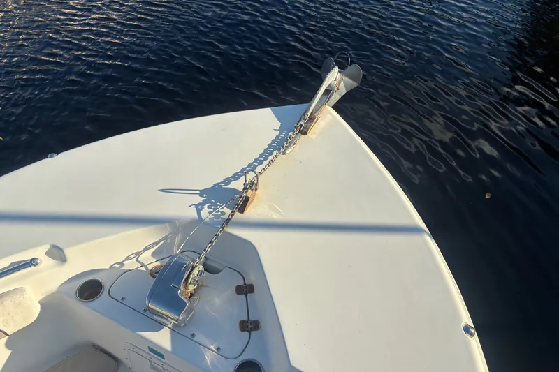 Slide: The Image of Bow of 2010 Key West 244 Center Console boat with anchor chain over water. - 4