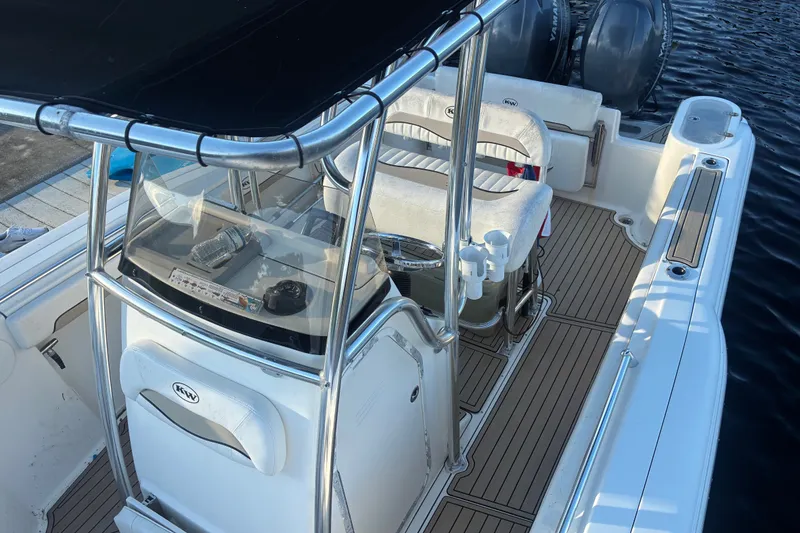 Slide: The Image of 2010 Key West 244 Center Console boat interior with seating and controls. - 22
