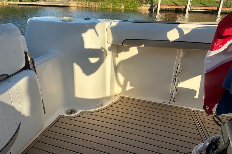 Slide: The Image of Interior of a 2010 Key West 244 Center Console boat with wooden flooring. - 38