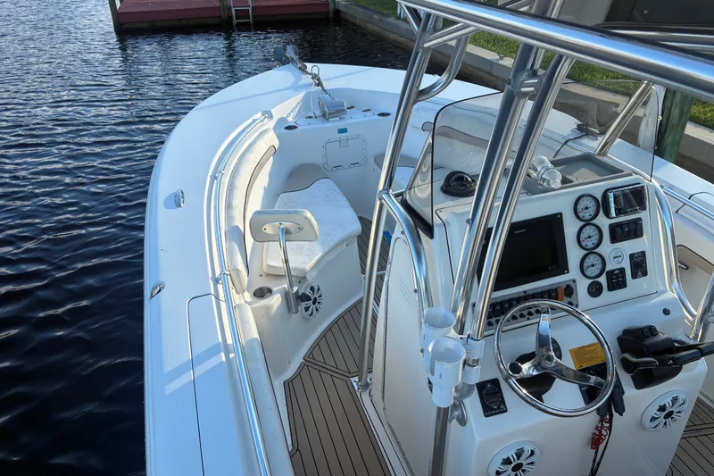Slide: The Image of 2010 Key West 244 Center Console boat with sleek design and modern dashboard. - 23