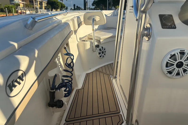 Slide: The Image of 2010 Key West 244 Center Console boat interior with seating and marine speakers. - 15