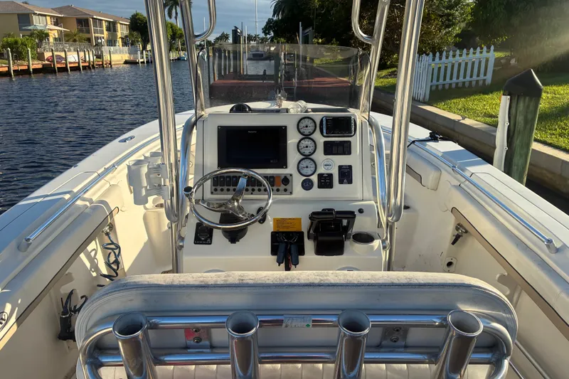 Slide: The Image of 2010 Key West 244 Center Console boat interior with steering wheel and control panel. - 18