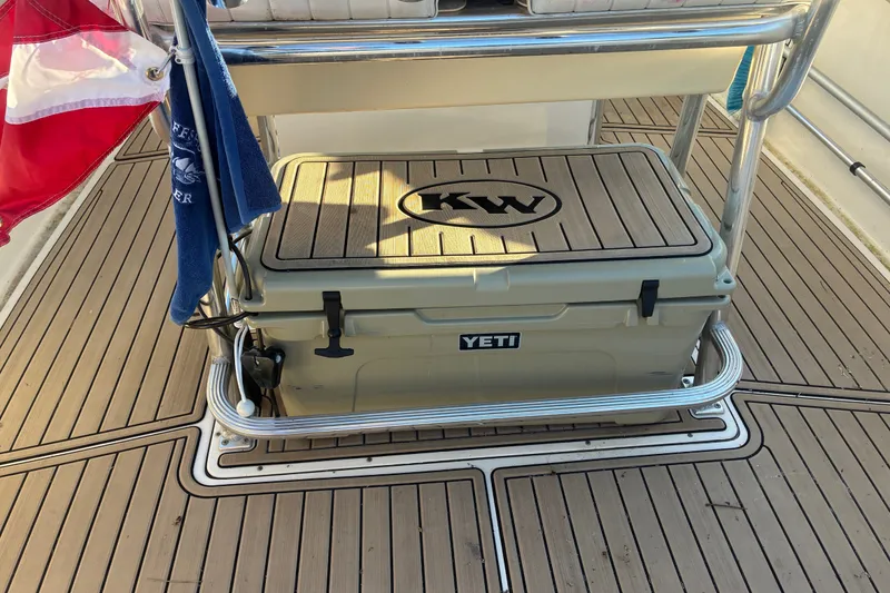 Slide: The Image of YETI cooler on 2010 Key West 244 Center Console boat deck with flag and towel. - 39
