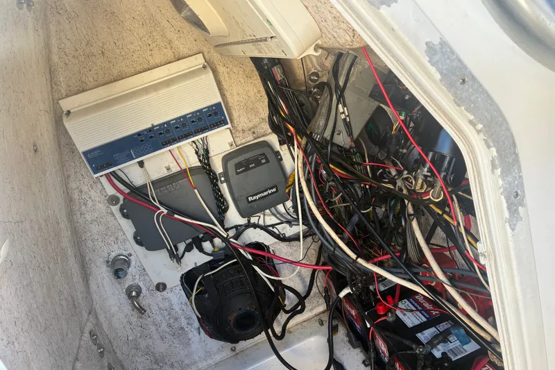 Slide: The Image of Electrical wiring and components inside a 2010 Key West 244 Center Console boat. - 47