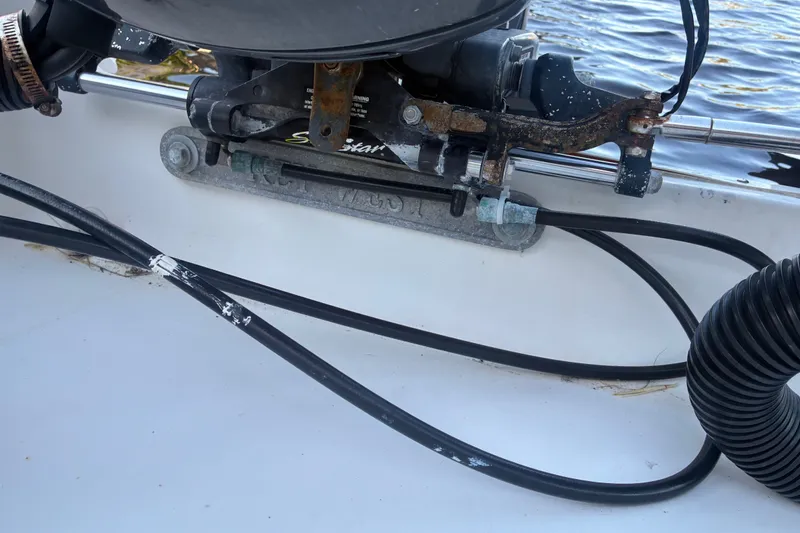 Slide: The Image of Close-up of a 2010 Key West 244 Center Console boat's engine mount and cables. - 33