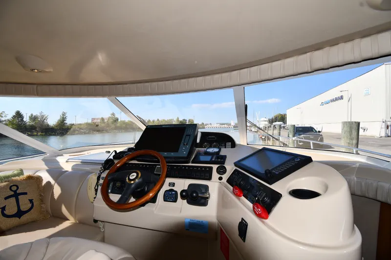 Slide: The Image of Interior view of 2003 Cruisers Yachts 5000 Sedan Sport helm with navigation equipment. - 69