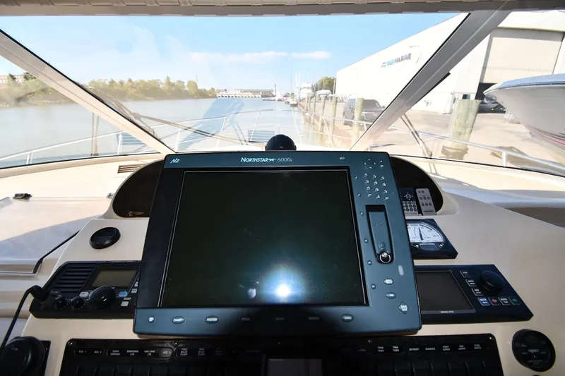 Slide: The Image of Cockpit view of 2003 Cruisers Yachts 5000 Sedan Sport with navigation equipment. - 70