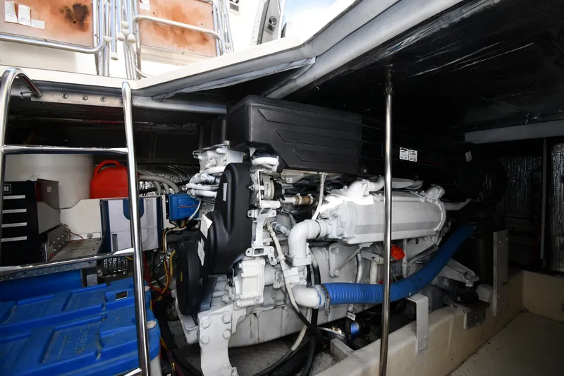 Slide: The Image of Engine room of 2003 Cruisers Yachts 5000 Sedan Sport with visible machinery and equipment. - 81