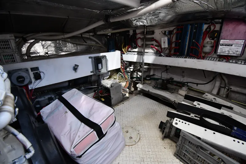 Slide: The Image of Engine room of 2003 Cruisers Yachts 5000 Sedan Sport, showcasing equipment and wiring. - 87