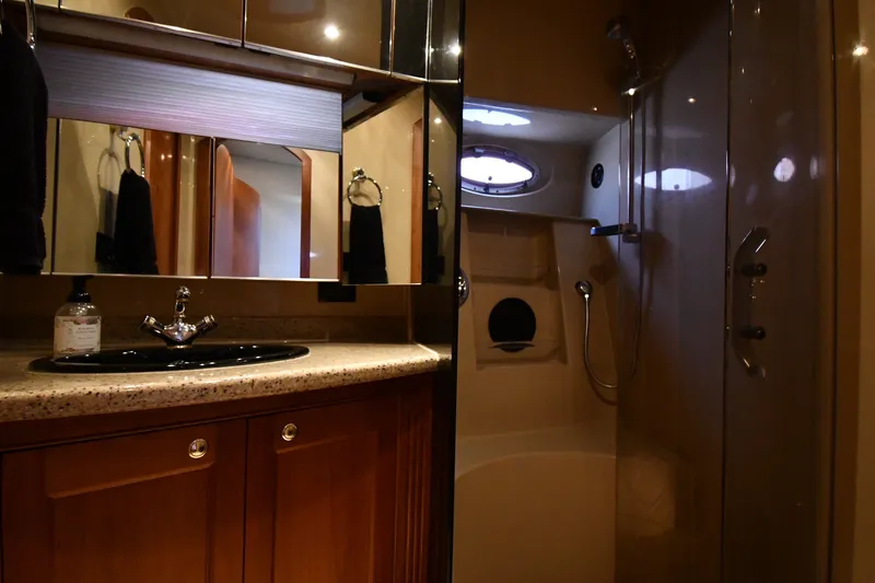 Slide: The Image of Luxurious bathroom interior of 2003 Cruisers Yachts 5000 Sedan Sport with shower and vanity. - 46