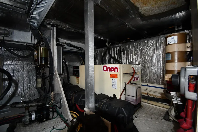 Slide: The Image of Engine room of 2003 Cruisers Yachts 5000 Sedan Sport with Onan generator. - 82